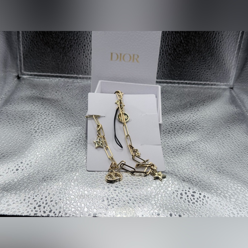 NIB Christian Dior CD Logo Gold Tone Phone Strap Charm comes with the box